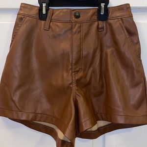Hollister Ultra high rise vegan leather shorts in brown color with pockets.